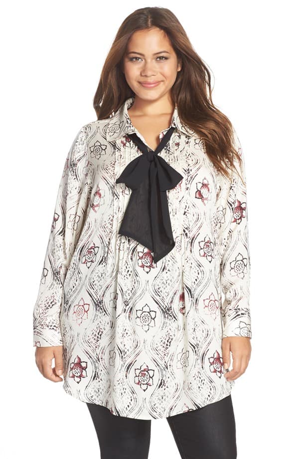 Woman wearing tie neck blouse by Melissa McCarthy Seven7.