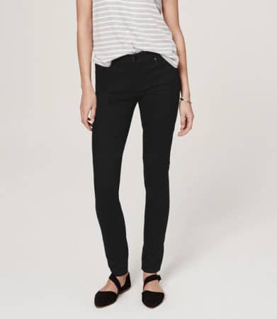 model wearing skinny jeans on white background