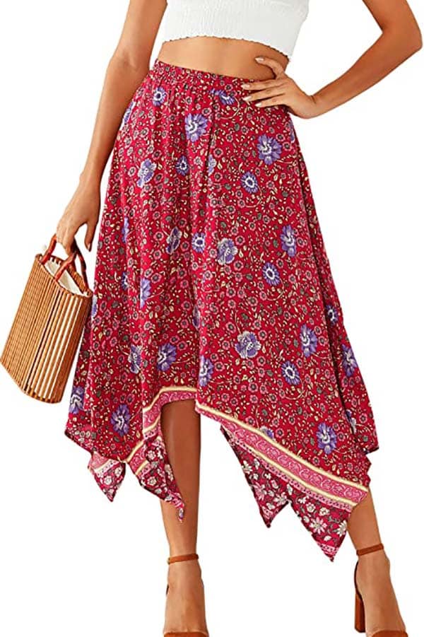Waist down view of model wearing high low summer skirt.