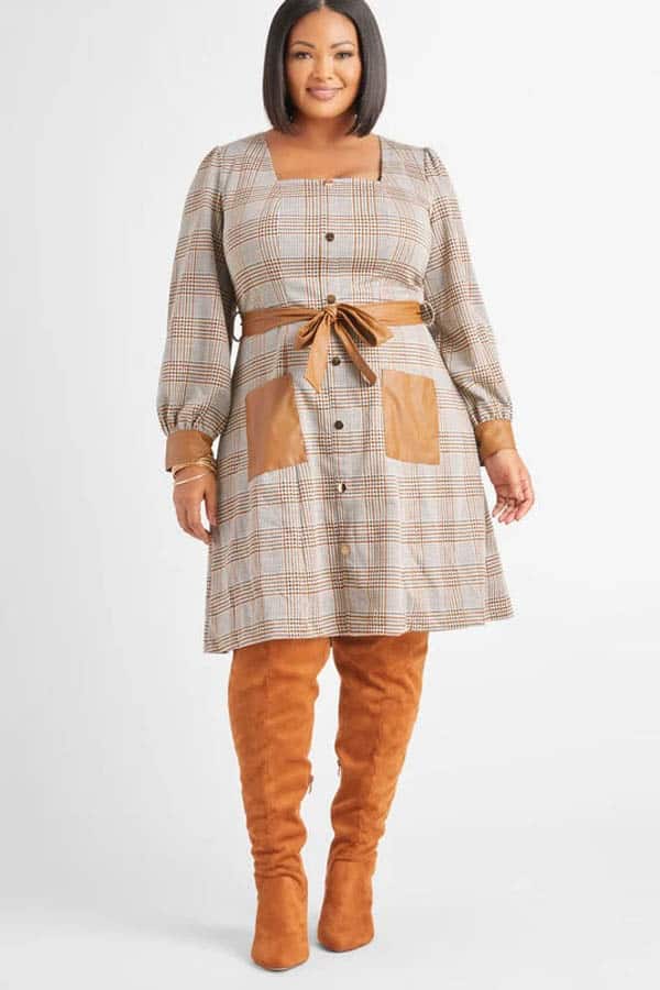 Model wears Ashley Stewart church dress in plaid.
