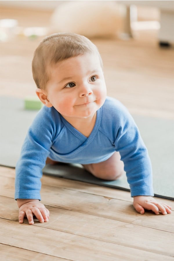 Baby wearing blue onesie 