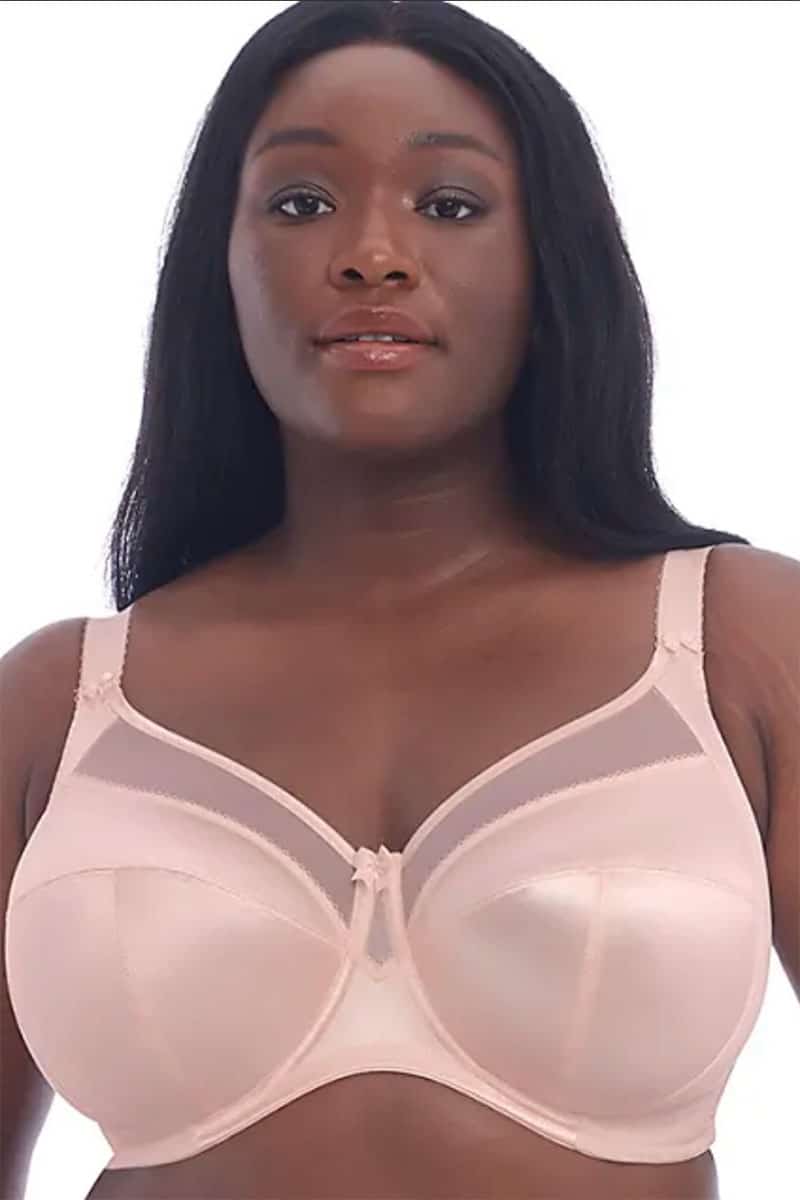 Model wears pink plus size bra.