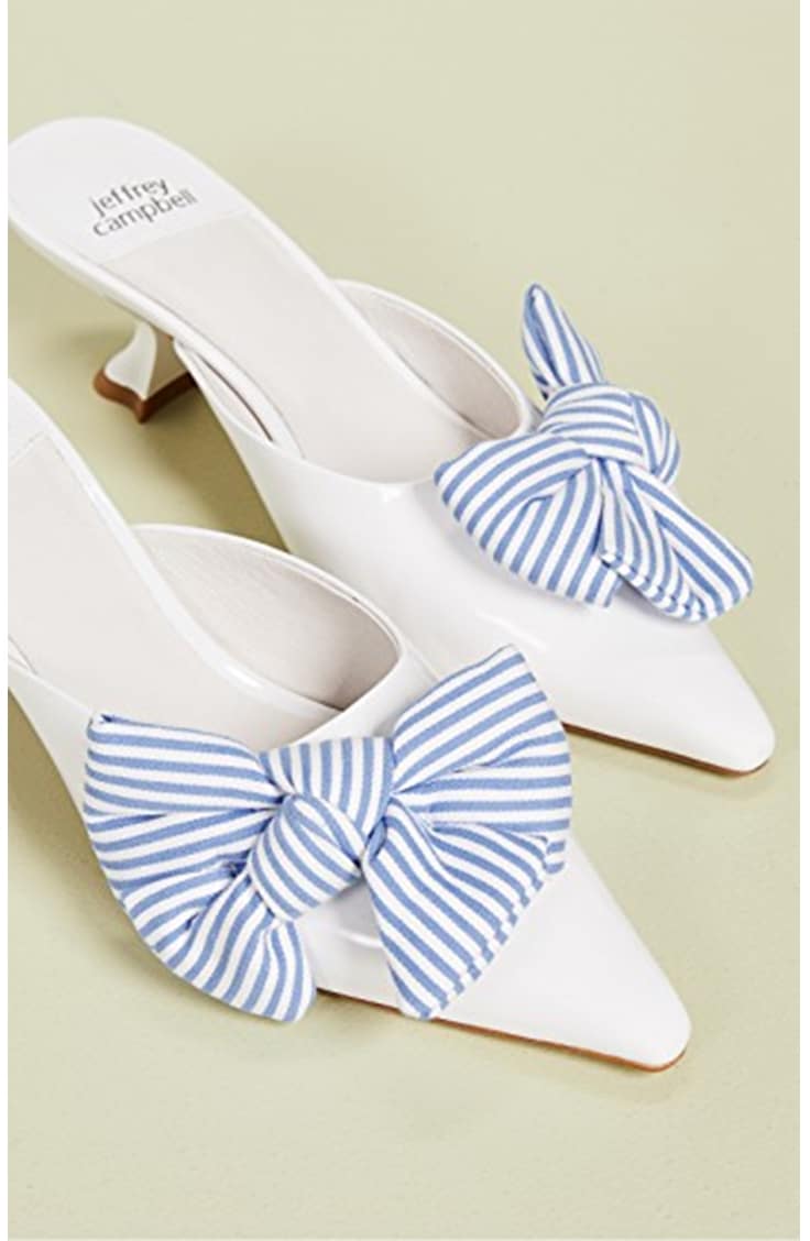 White kitten heels with blue bows