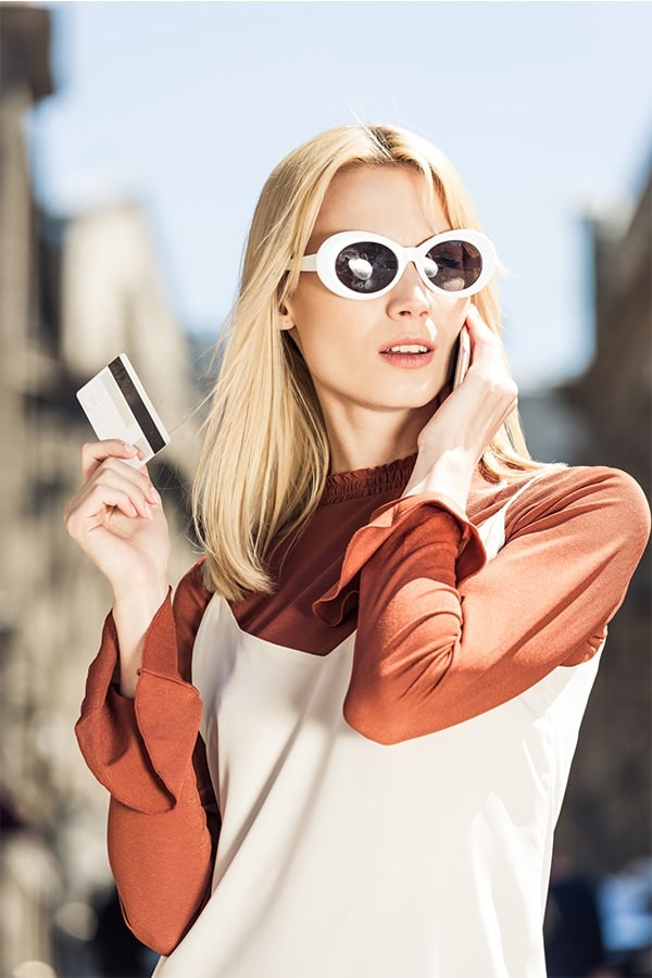 Stylish woman with credit card.