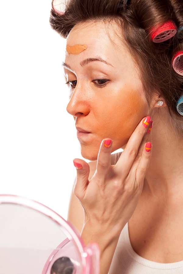 Woman with unmatched makeup.