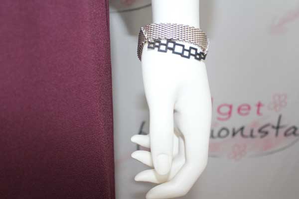 mannequin wearing stacked bracelets