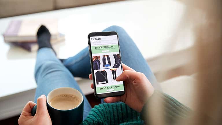 Woman shopping for clothes online.