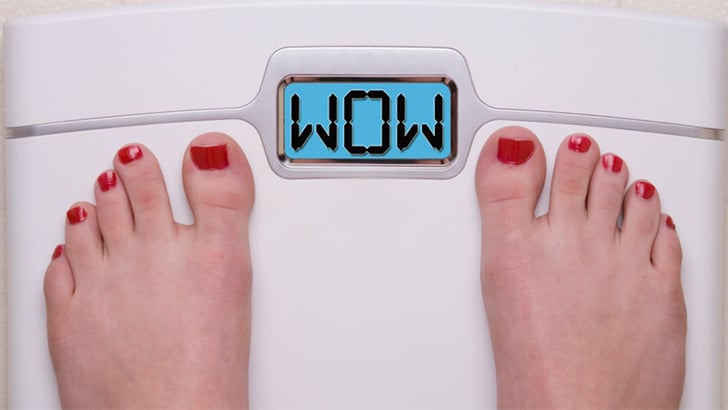 Image of women's feet on scale, to represent the best clothes for weight loss.