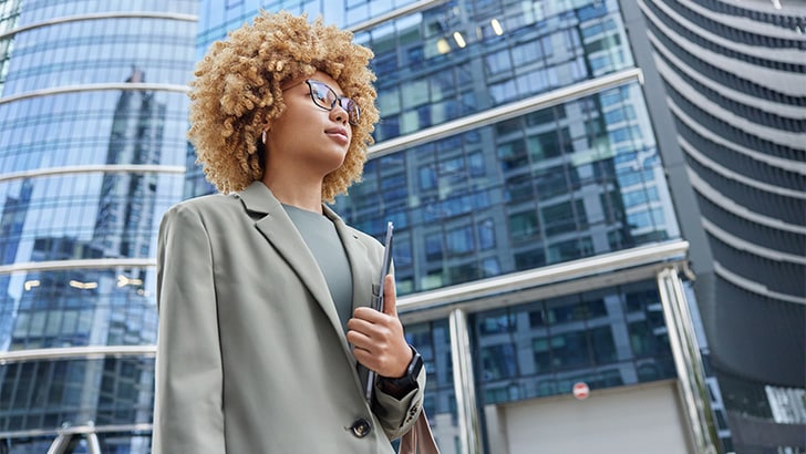Woman outside wearing conservative fashion.