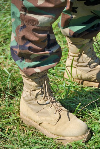 foot soldier in camouflage pants and boots