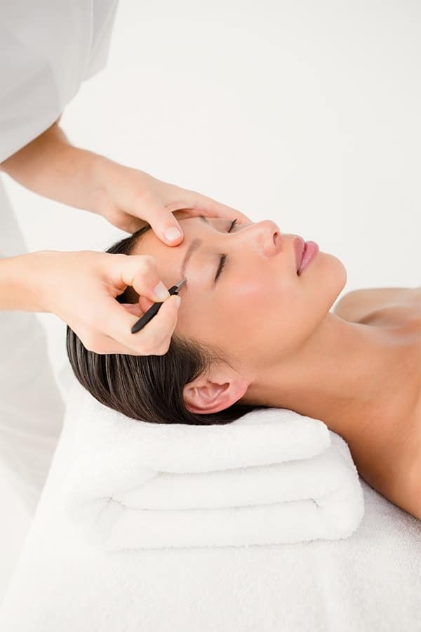 Woman getting her eyebrows done