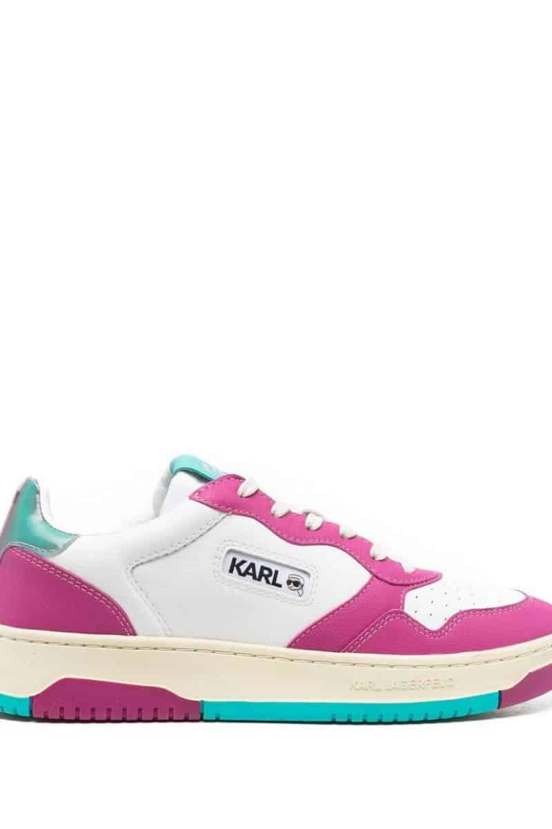 Pink and white tennis shoe discounted in Farfetch sale.