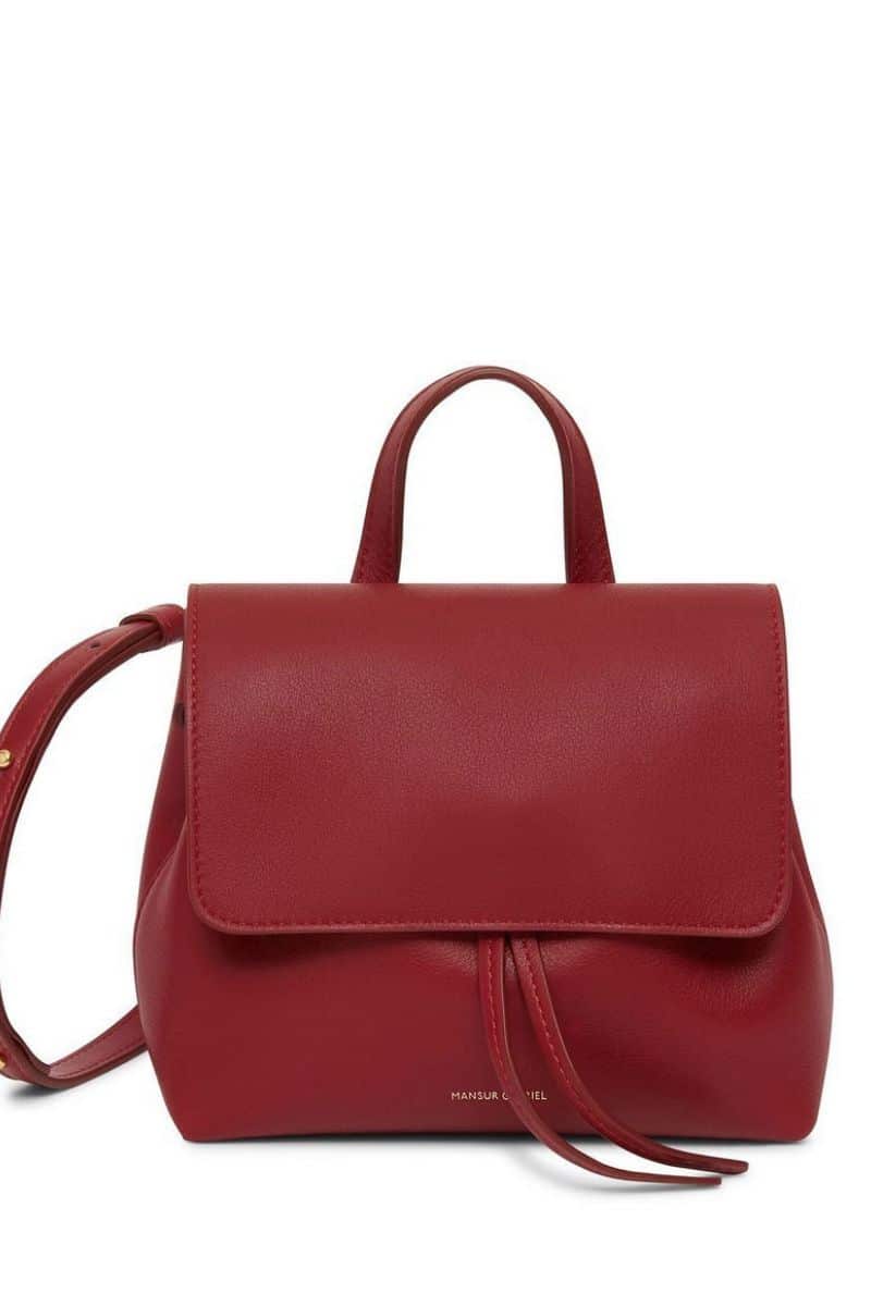 Red handbag discounted in Farfetch sale.