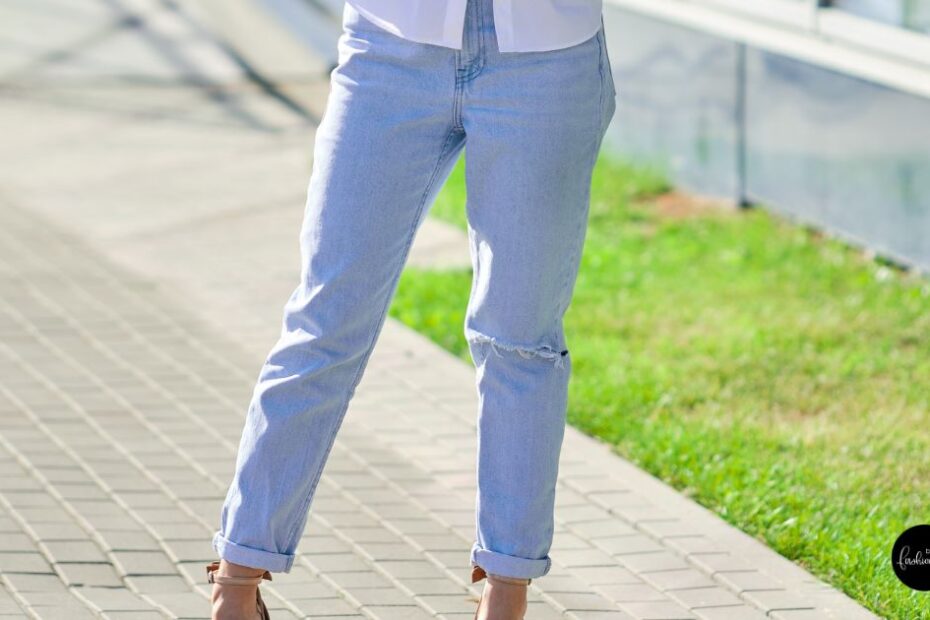 Woman in light blue boyfriend jeans