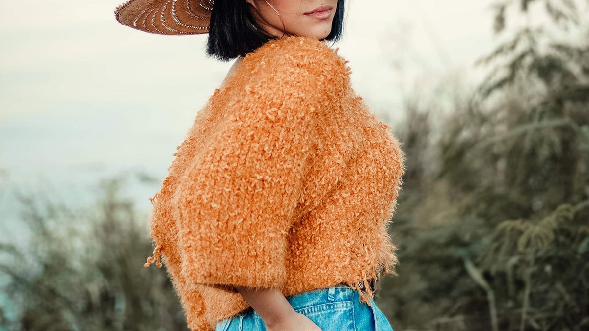 Woman wearing cropped sweater