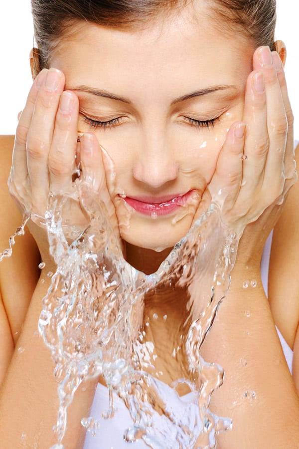 Woman washing her face 