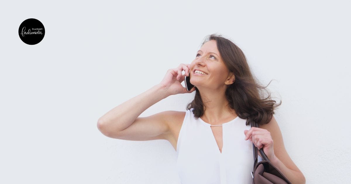 Woman looking up while talking on cell phone.