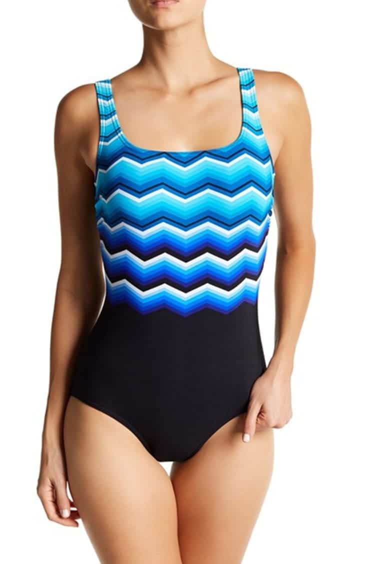 Tall woman wearing one-piece swimsuit