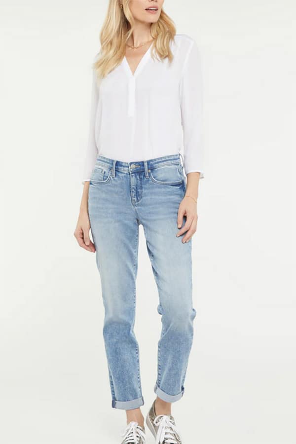 Model wearing NYDJ girlfriend petite jeans.