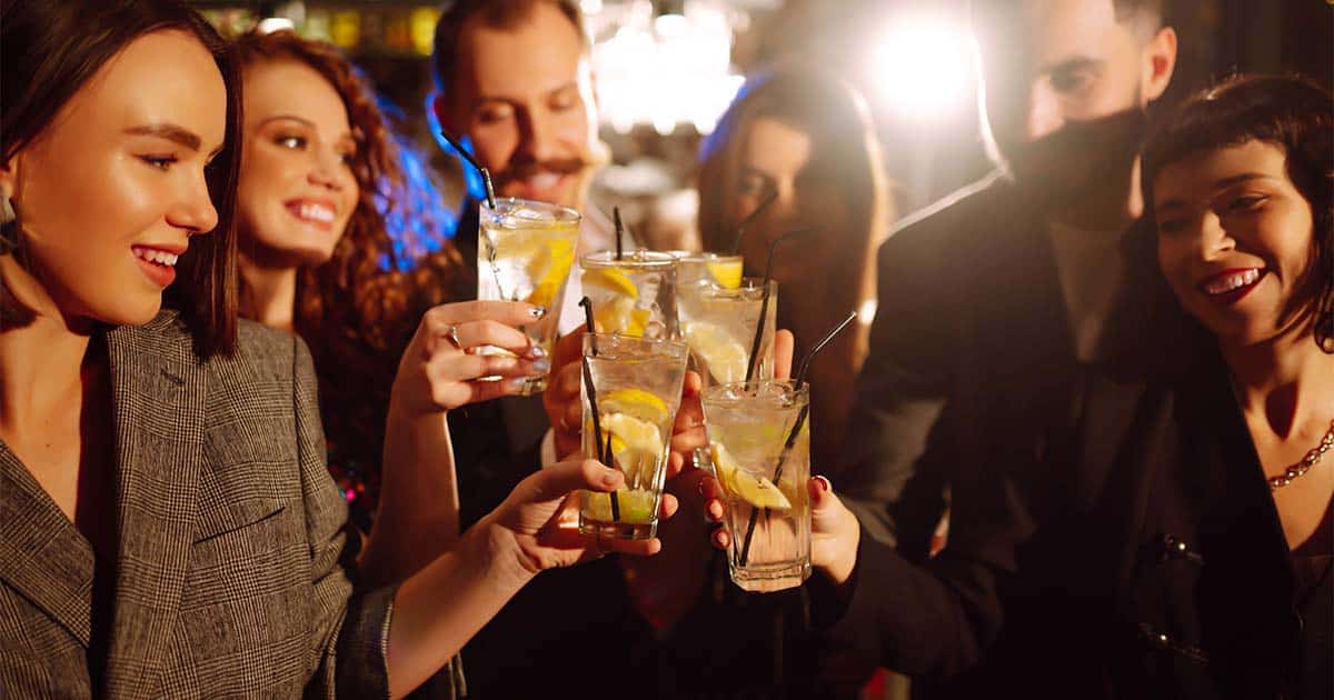 Group of coworkers drinking together at holiday party.