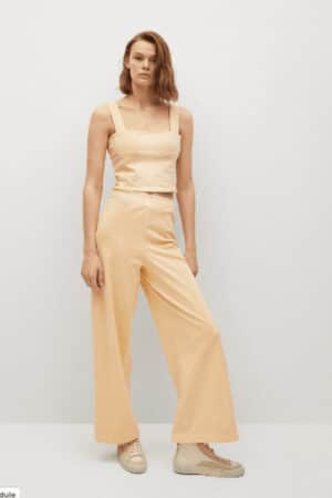 Pastel yellow pants by Mango.
