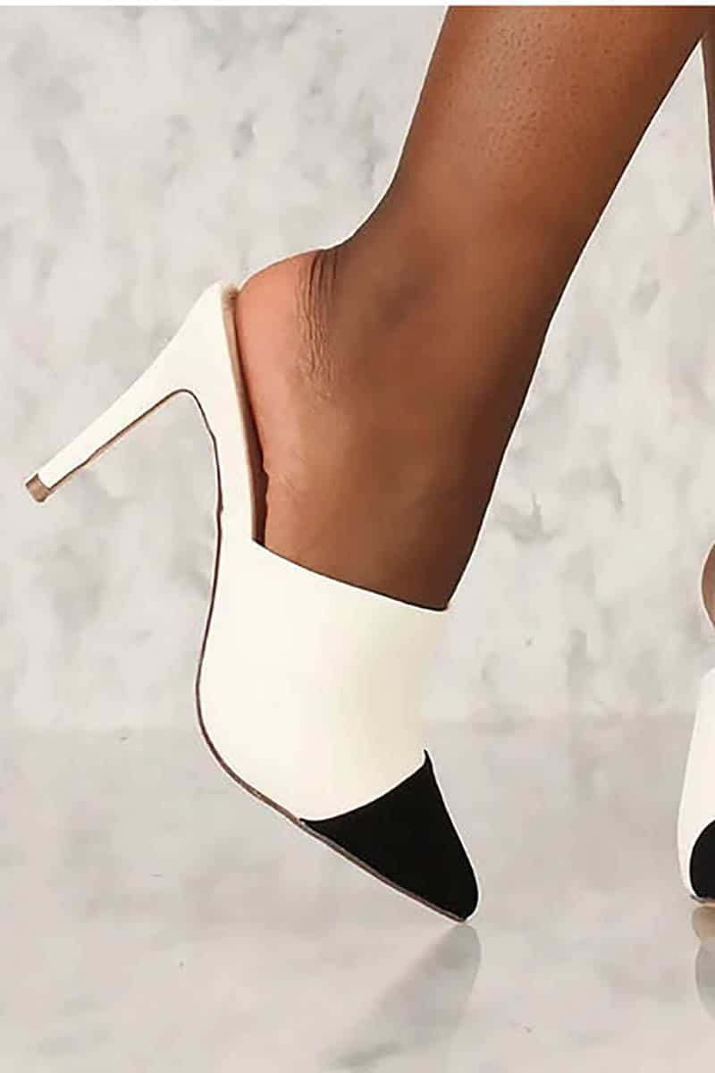 Black and white pointed toe, heeled mule.