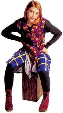 Woman wearing multiple clashing prints