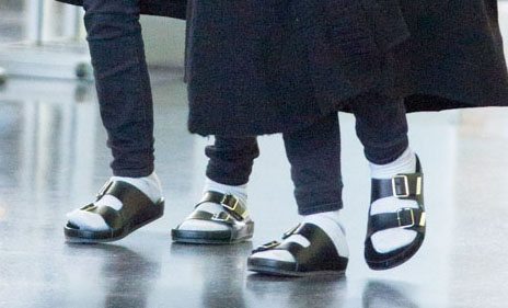 Two people wearing Birkenstock sandals