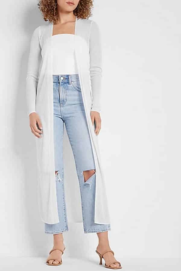 Model wears longline, sheer cardigan.