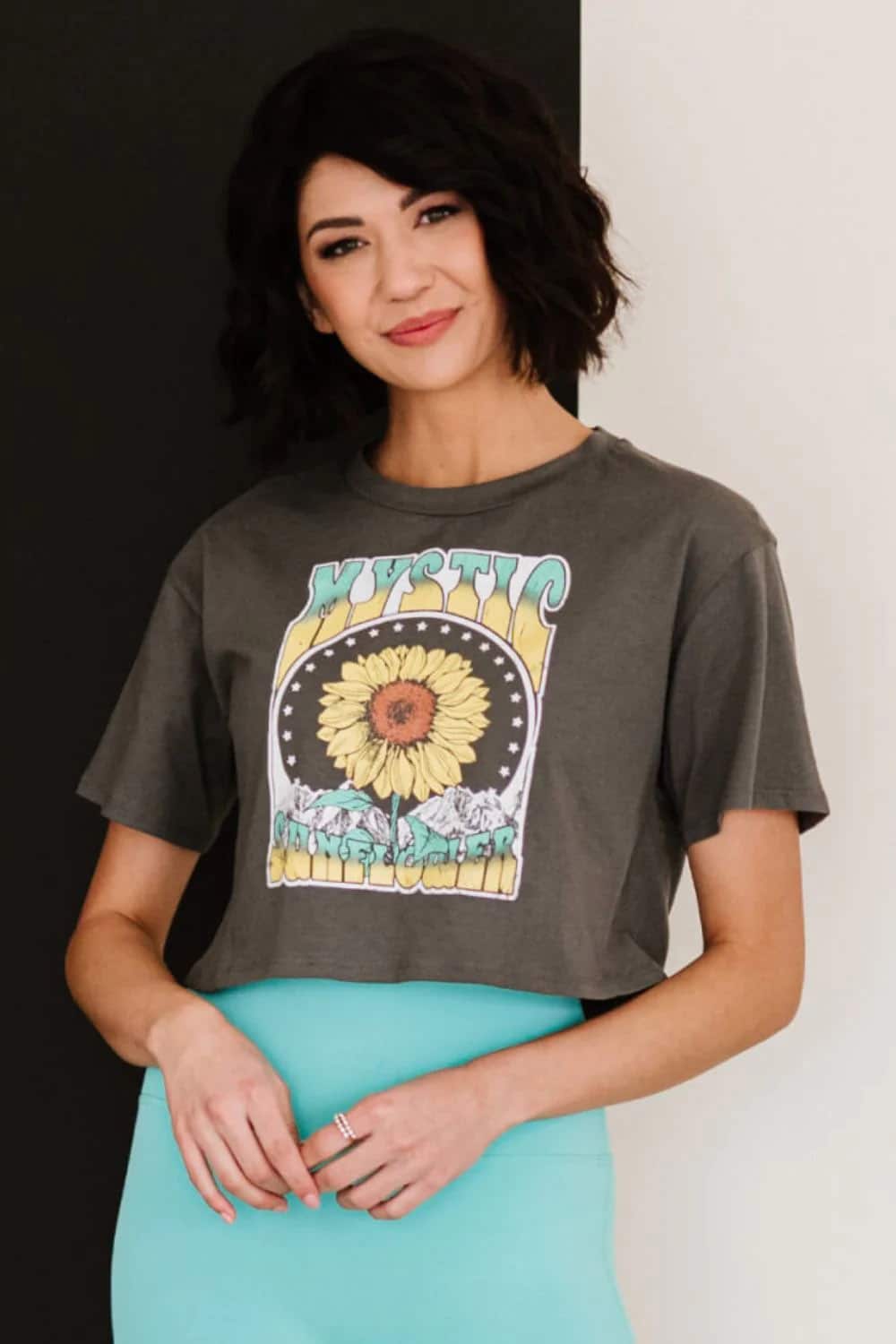 Women shows summer style by wearing crop top.