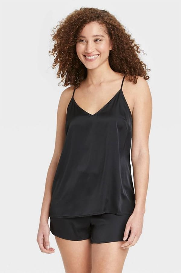 Model wears black pajama set from Target.