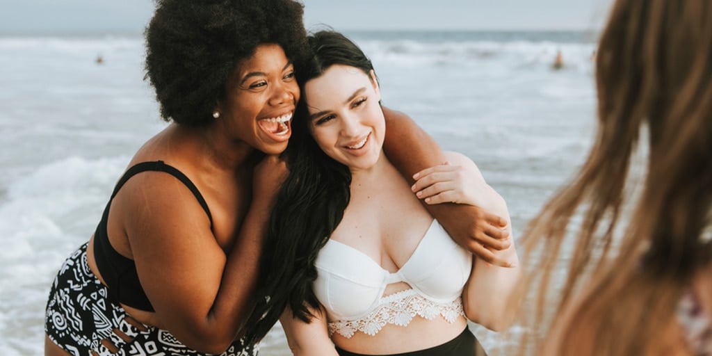 Beautiful plus size women having fun on the beach