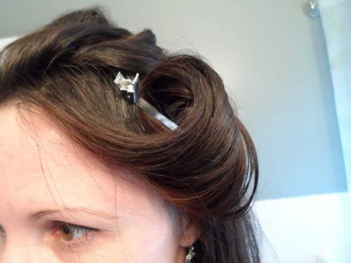 Woman with clips in curled hair 