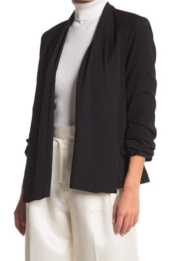 Woman wearing black tuxedo jacket