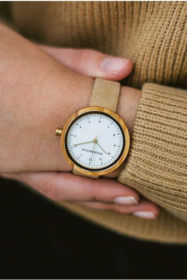 Close up of woman's arm wearing watch from charity brand Woodwatch.