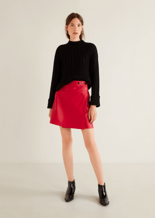 Woman wearing bright red leather skirt