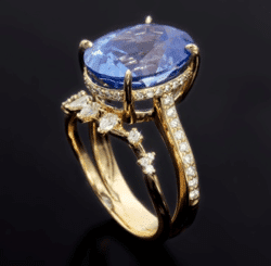 Ring with large blue stone and custom setting