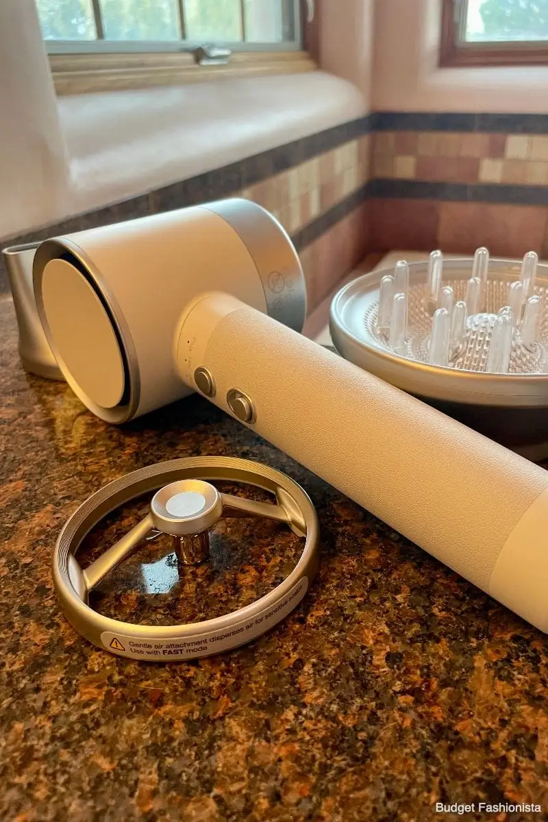 Zuvi Halo hair dryer with attachments on bathroom counter.